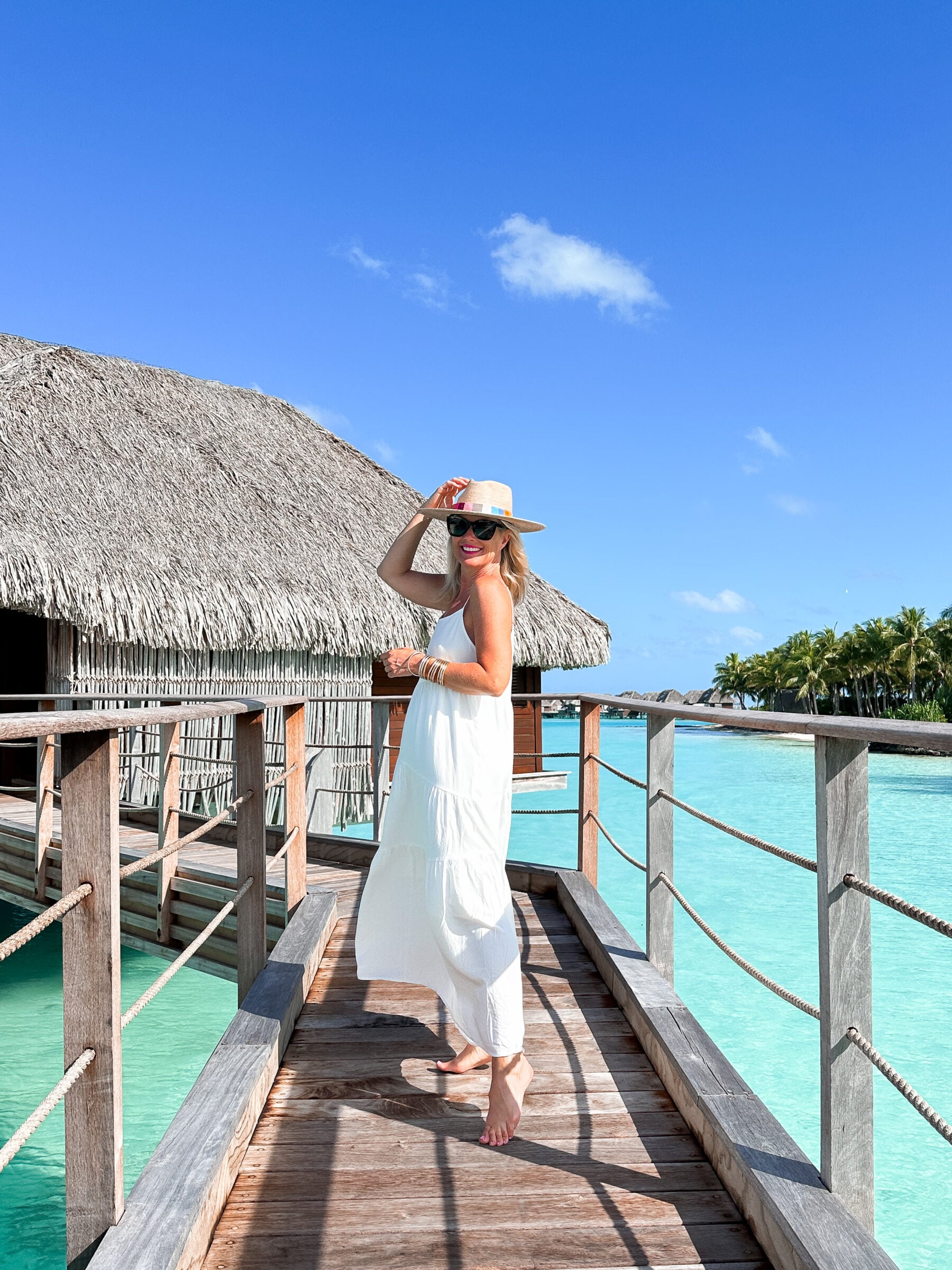 Timeless Tropical: White Tiered Maxi Dress and Straw Hat Timeless Tropical: White Tiered Maxi Dress and Straw Hat — Bora Bora Outfits 2027