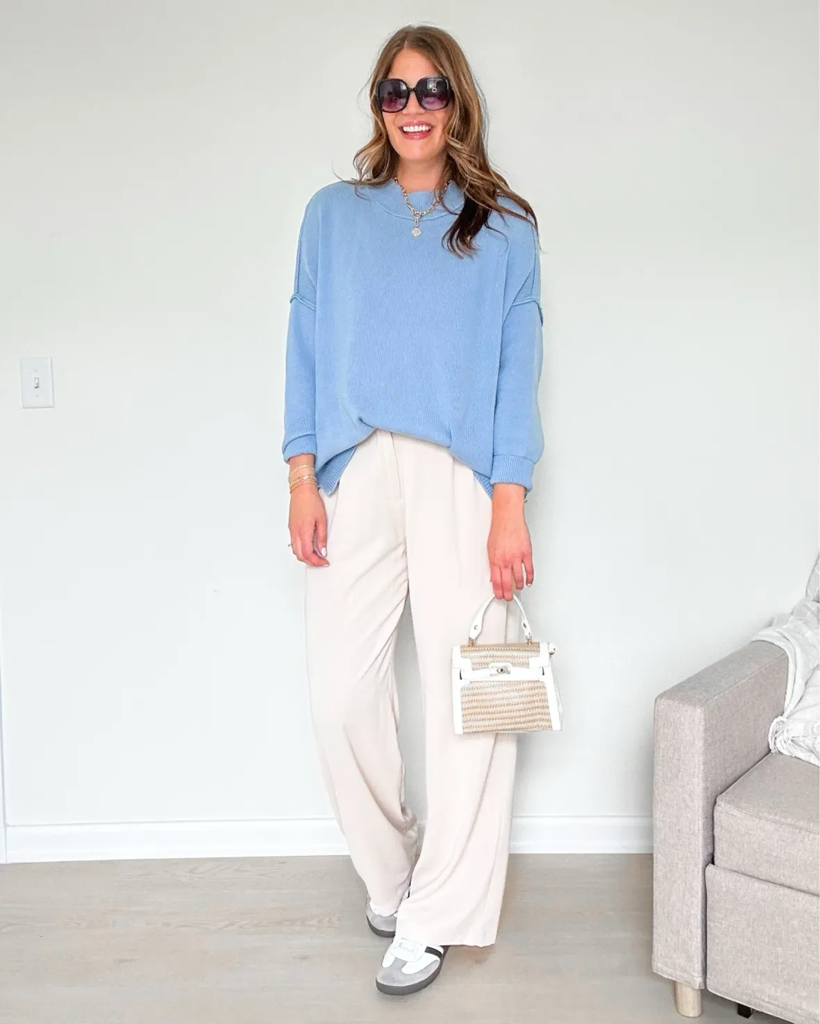 Light Blue Knit Sweater and Cream Trousers with Grey & White Sneakers Light Blue Knit Sweater and Cream Trousers with Grey & White Sneakers — Adidas Samba Spring Outfits 2027