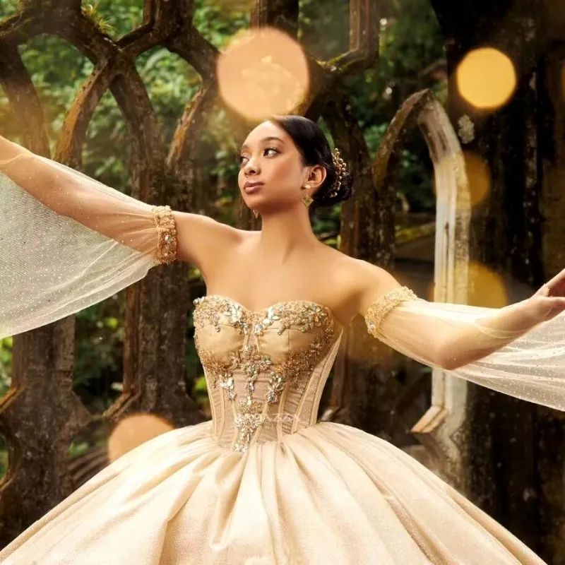 Champagne Ball Gown with Embellished Bodice and Sheer Sleeves — Champagne Quinceanera Dress 2027