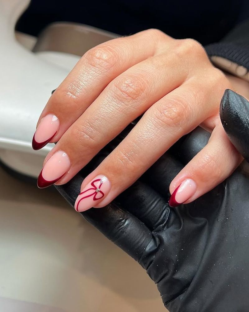 Precise Lines Clean Cuticle Work Medium Oval Dark Red French With Bow Accent Precise Lines Clean Cuticle Work Medium Oval Dark Red French With Bow Accent — Bow French Tip Nails 2027