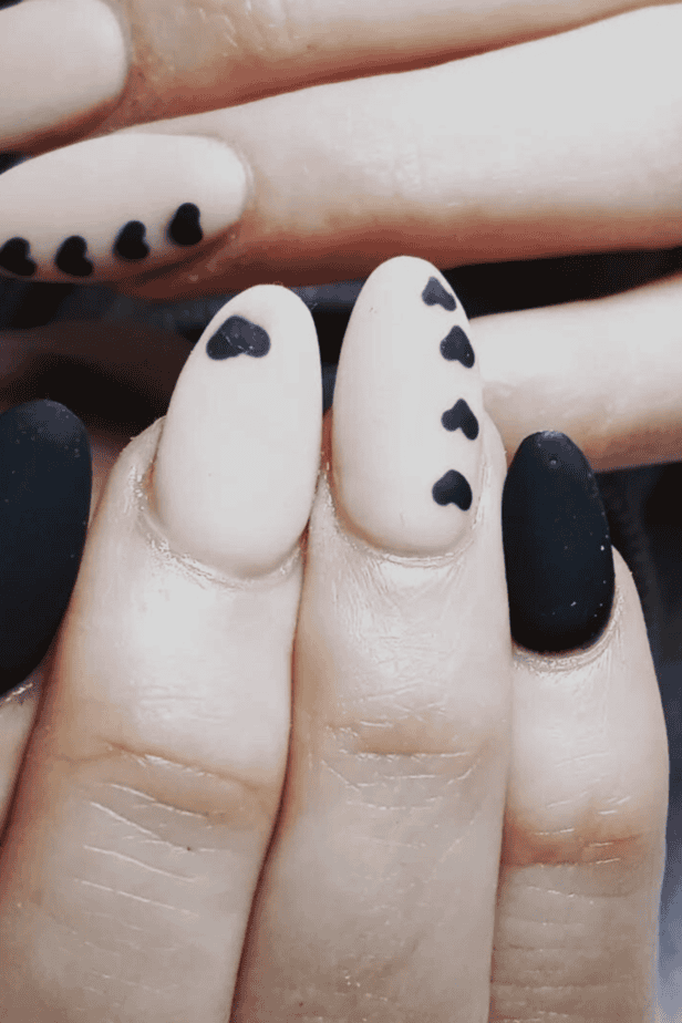 Moody Matte Black Oval with Hearts Moody Matte Black Oval with Hearts — Mismatched Heart Nails 2027