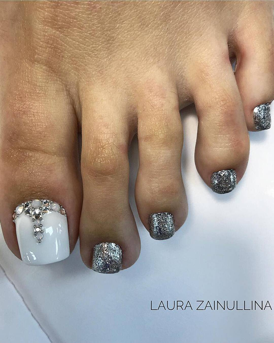 White Base with Glitter and Rhinestone Big Toe Accent White Base with Glitter and Rhinestone Big Toe Accent — Silver Toe Nails 2027