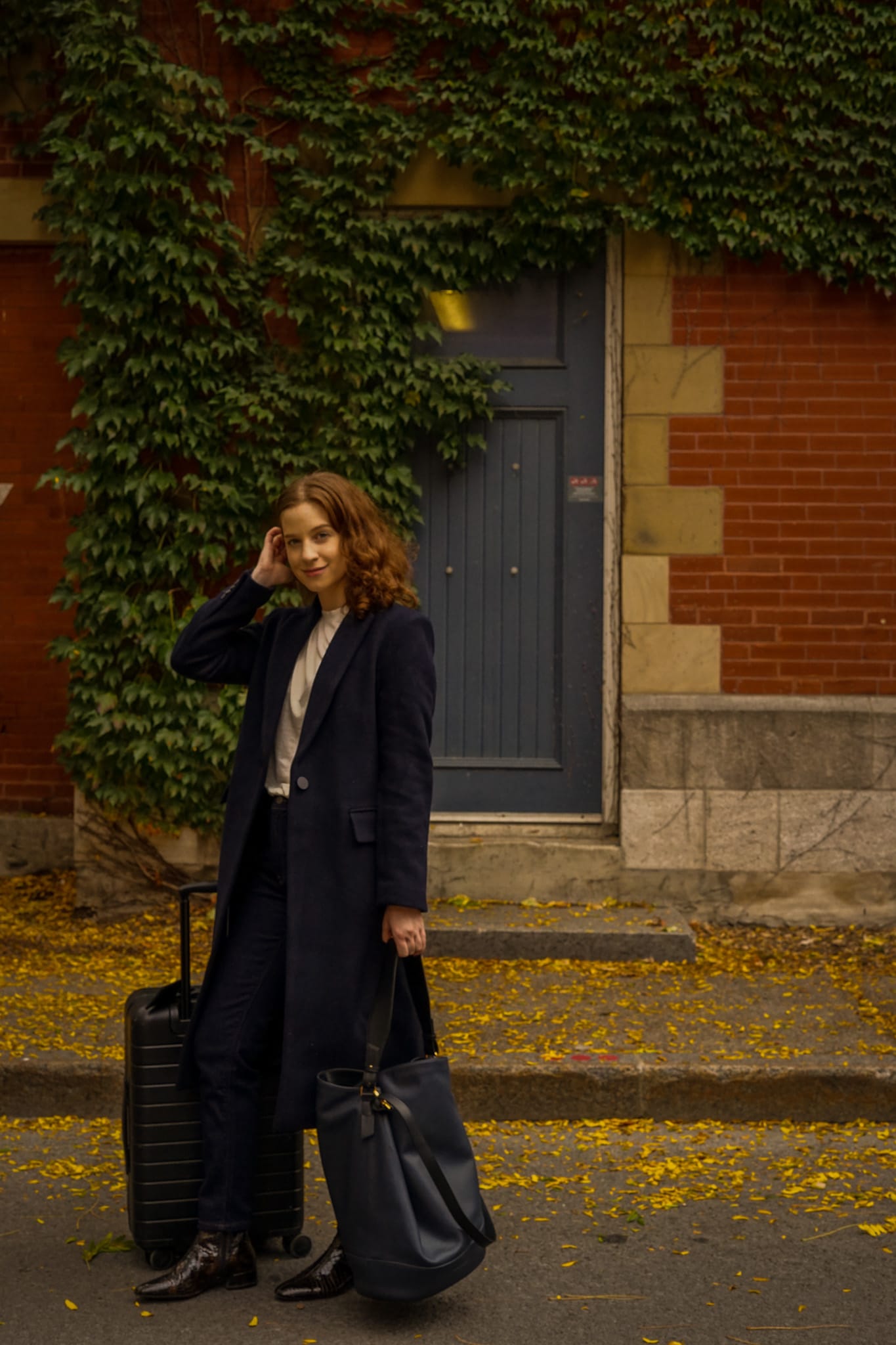 Long Navy Coat Over Denim for Chic Travel Long Navy Coat Over Denim for Chic Travel — Business Trip Outfits 2027