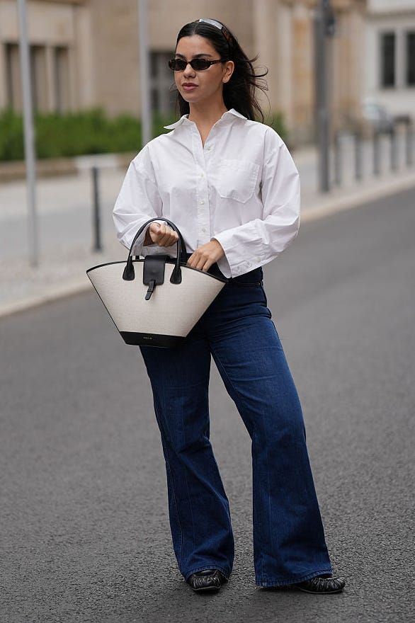 White Oversized Button-Down Shirt with Dark Blue Bootcut Jeans White Oversized Button-Down Shirt with Dark Blue Bootcut Jeans — Blue Bootcut Jeans Outfits 2027