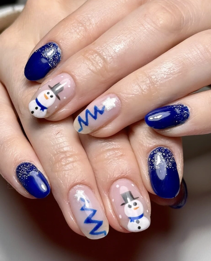 Short Oval Snowman and Zig-Zag Nails Short Oval Snowman and Zig-Zag Nails — Blue Christmas Nails 2026