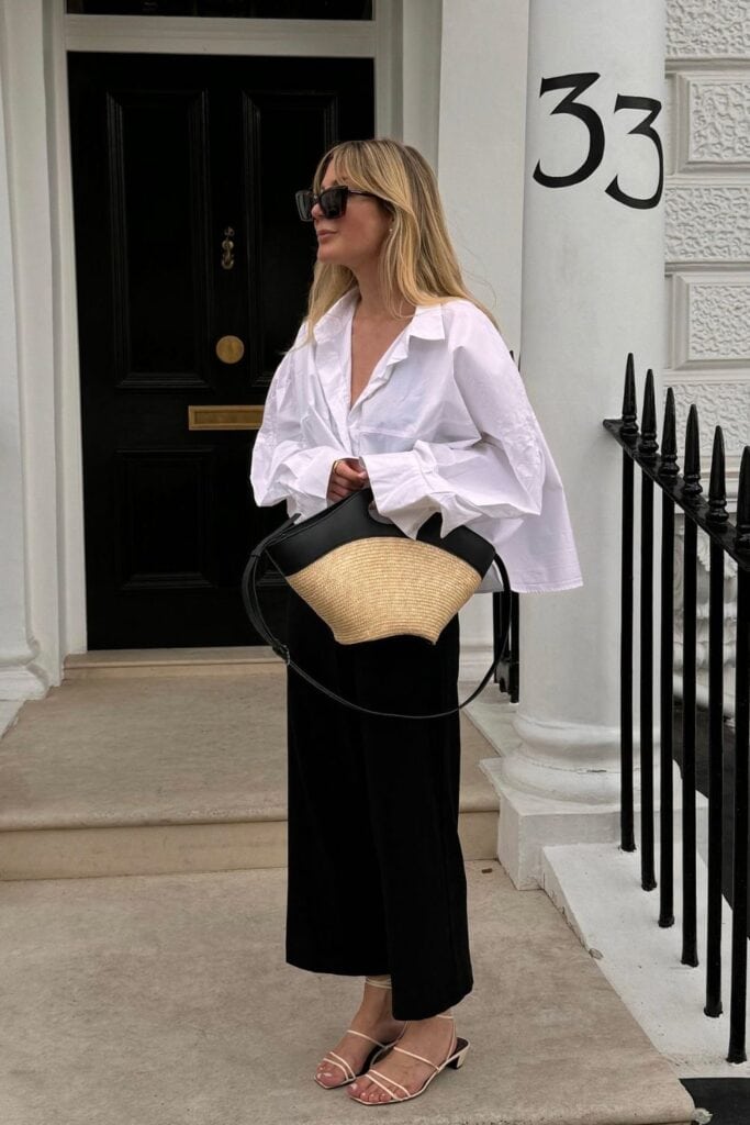 Minimalist White Shirt with Black Wide-Leg Trousers and Straw Tote — Oversized Shirt Outfits 2027