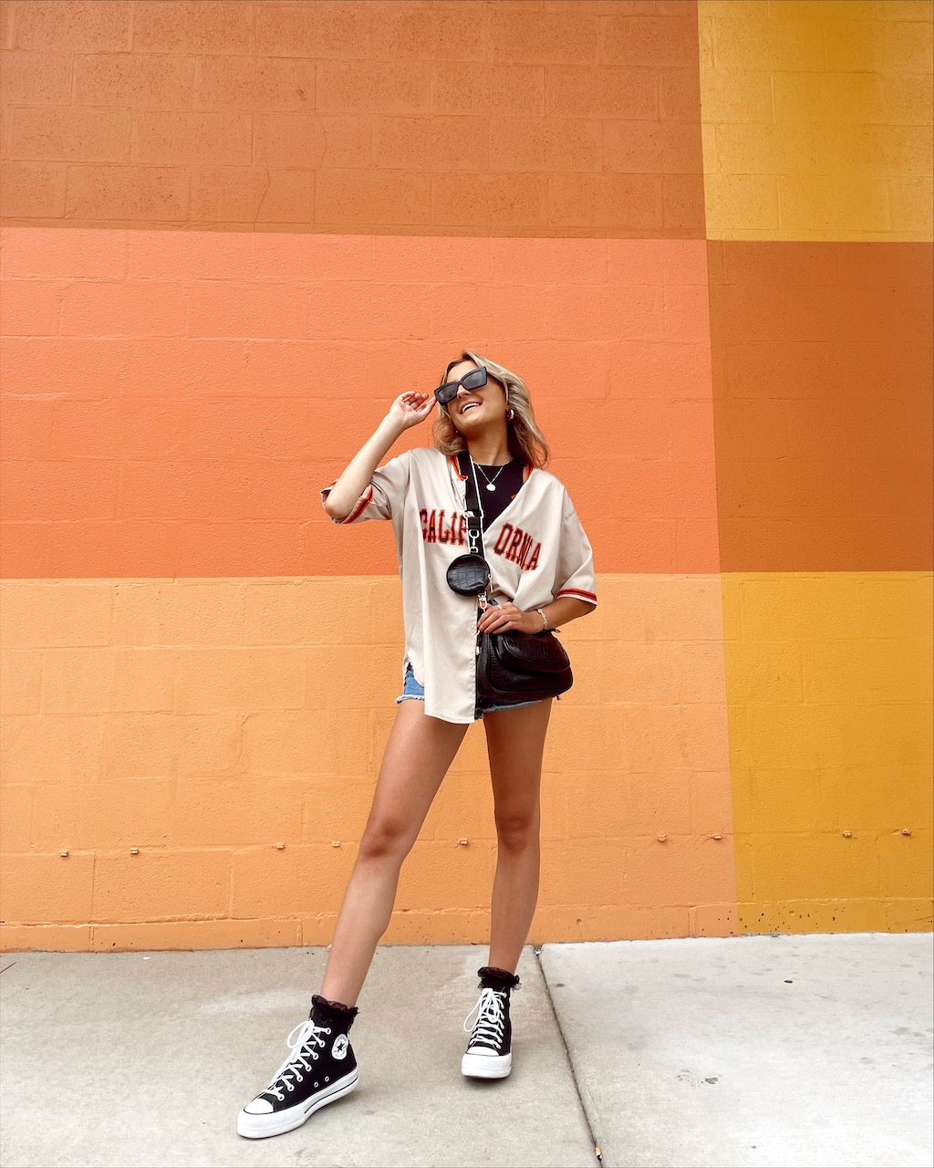 Sporty Chic: Baseball Jersey and Denim Shorts Sporty Chic: Baseball Jersey and Denim Shorts — Chicago Outfits 2027