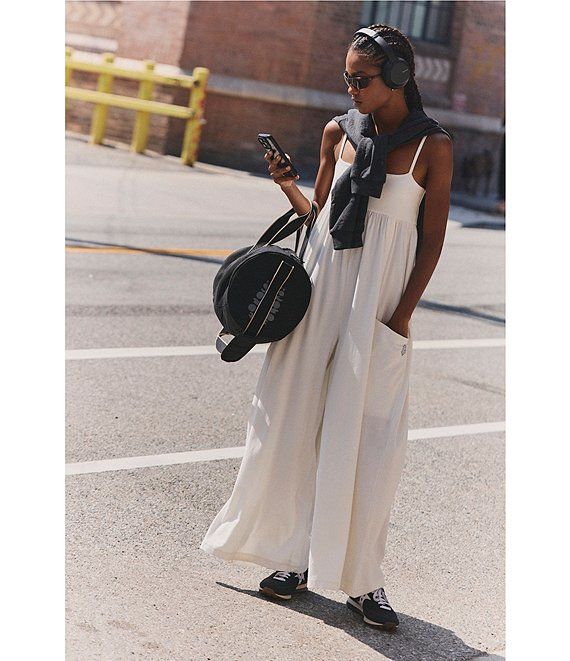 Oversized Sleeveless Jumpsuit Layered with a Grey Sweater Oversized Sleeveless Jumpsuit Layered with a Grey Sweater — Sleeveless Jumpsuit Outfits 2027