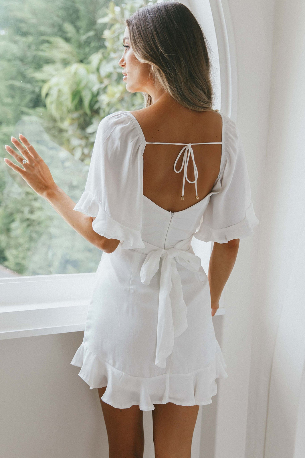 White Linen-Like Mini Dress with Flutter Sleeves and Ruffled Hem White Linen-Like Mini Dress with Flutter Sleeves and Ruffled Hem — Ruffle Hem Dress 2027