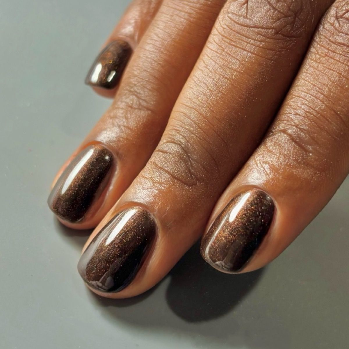 Dark Brown Cat-Eye Shimmer Oval Nails Dark Brown Cat-Eye Shimmer Oval Nails — Winter Nail Colors 2027 for Dark Skin
