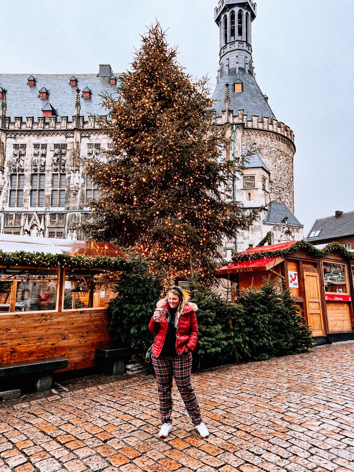 Red Puffer Jacket and Plaid Pants for a Playful Market Outfit — Christmas Market Outfits 2026