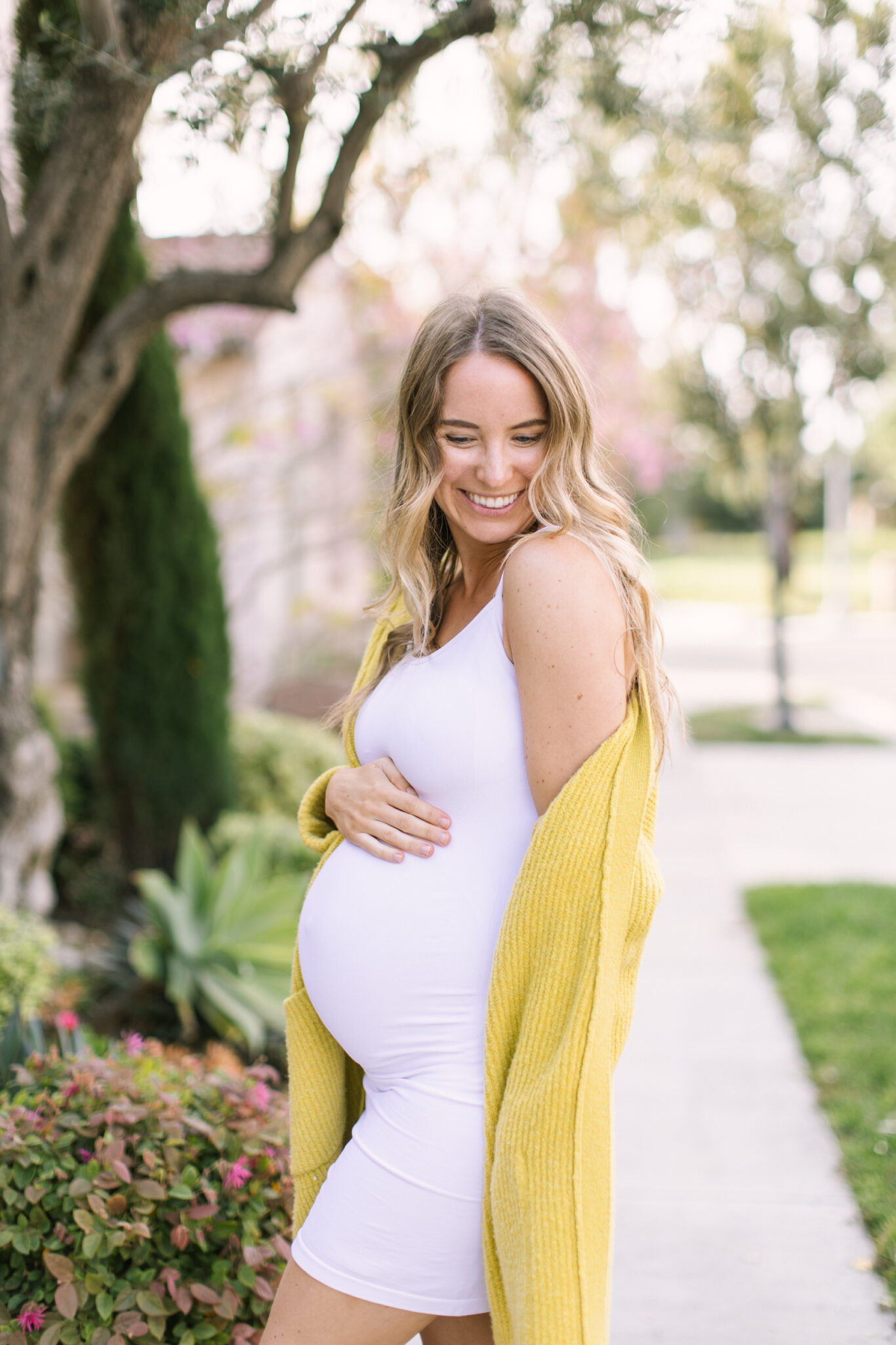 White Fitted Dress with Bright Yellow Cardigan for a Pop of Color White Fitted Dress with Bright Yellow Cardigan for a Pop of Color — Summer Baby Shower Outfits 2027