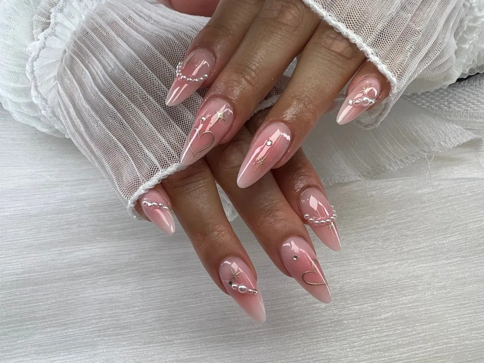 Pink to Clear Ombre Stars Pearls Almonds Pink to Clear Ombre Stars Pearls Almonds — Long Almond Pink Nails Ideas 2027
