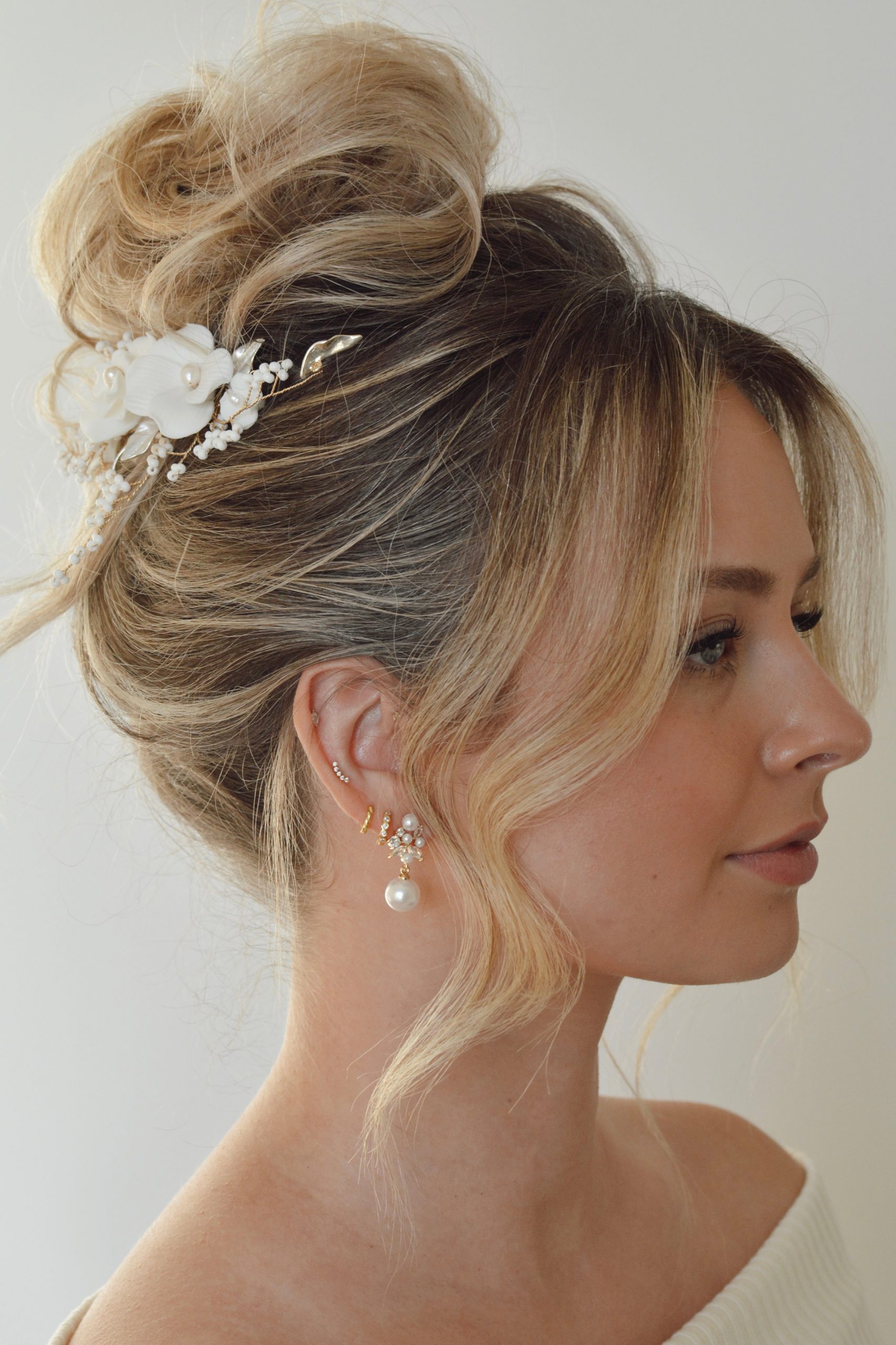 Low Bun with Braids and Flowers Low Bun with Braids and Flowers — Bun Hairstyles 2027