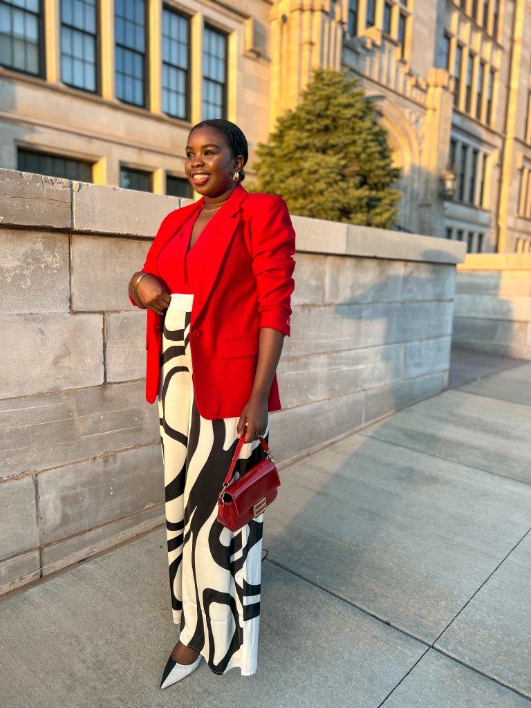 Bold Red Blazer Elevates a Patterned Jumpsuit for a Graduation Speaker — Graduation Speaker Outfits 2027