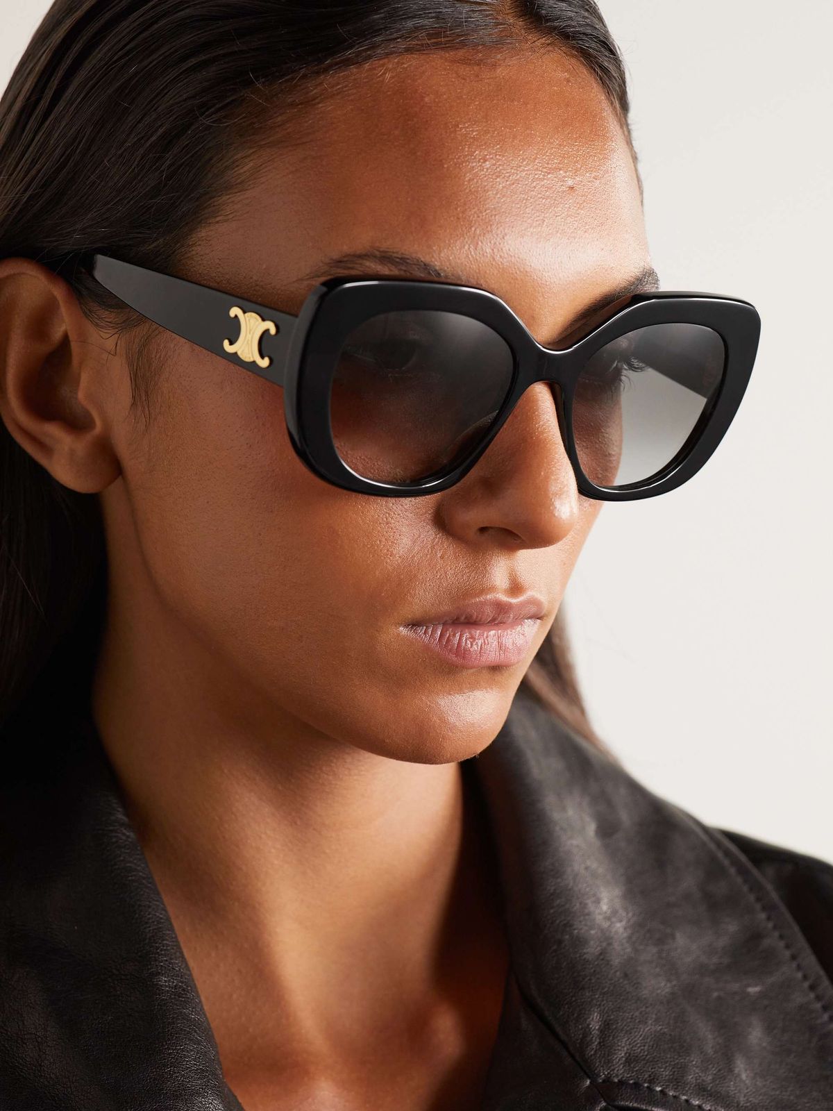 Black Leather Jacket Meets Oversized Cat Eyes with Logo — Cat Eye Sunglasses Outfits 2027