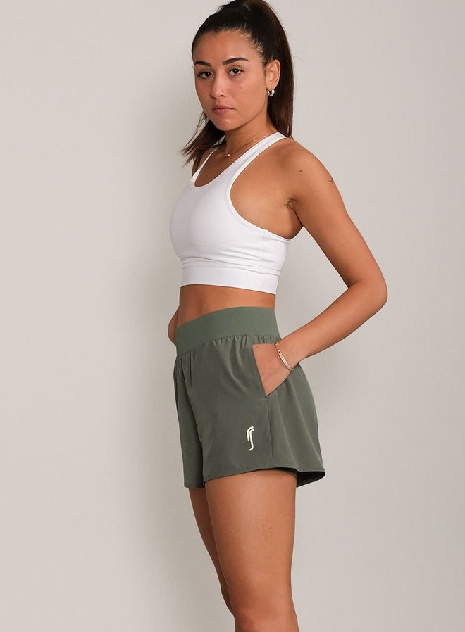White Sports Bra and Olive Green Shorts for Comfort — Gym Outfits 2027