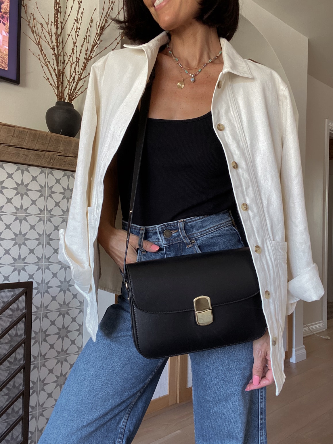Casual Comfort: Black Tank with Cream Oversized Shirt and Blue Jeans — Tank Top Outfits 2027