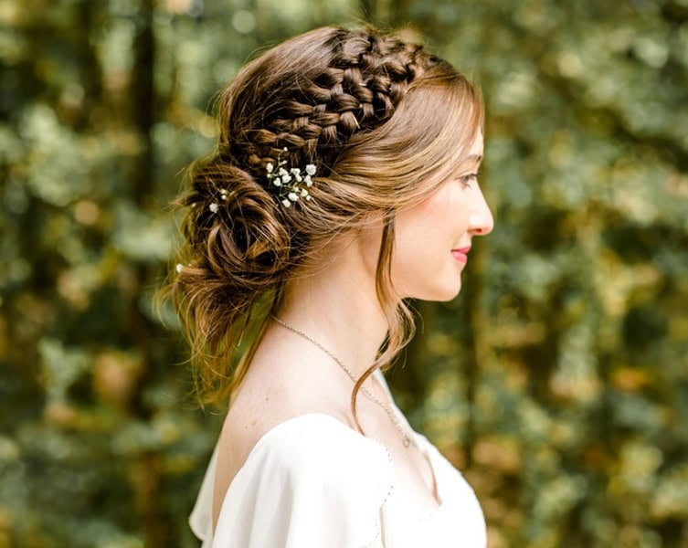 Braided Crown With Low Bun And Flowers — Wedding Updos 2027