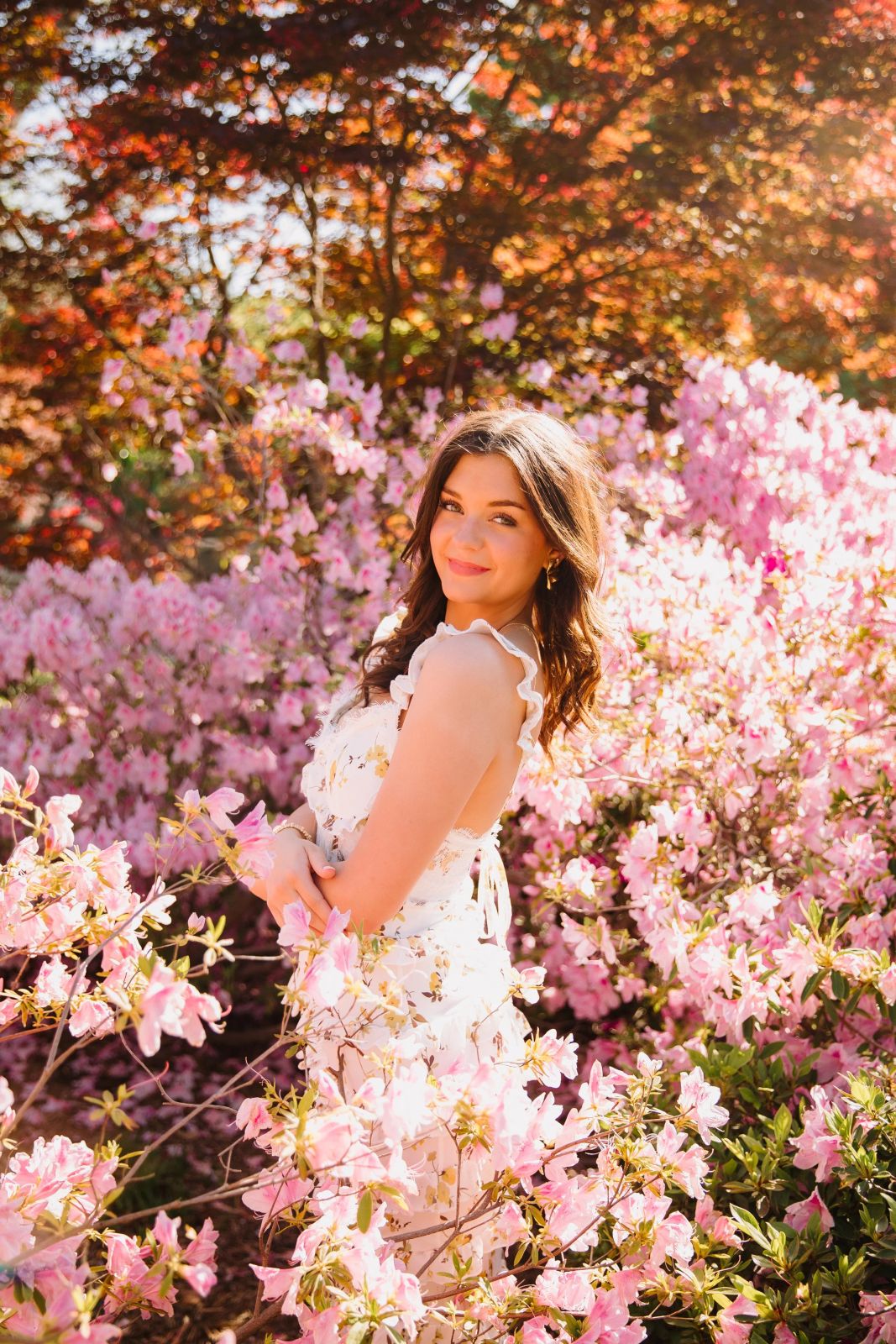 Springtime Romance: Floral Mini Dress in Garden Setting Springtime Romance: Floral Mini Dress in Garden Setting — Senior Photo Outfits 2027
