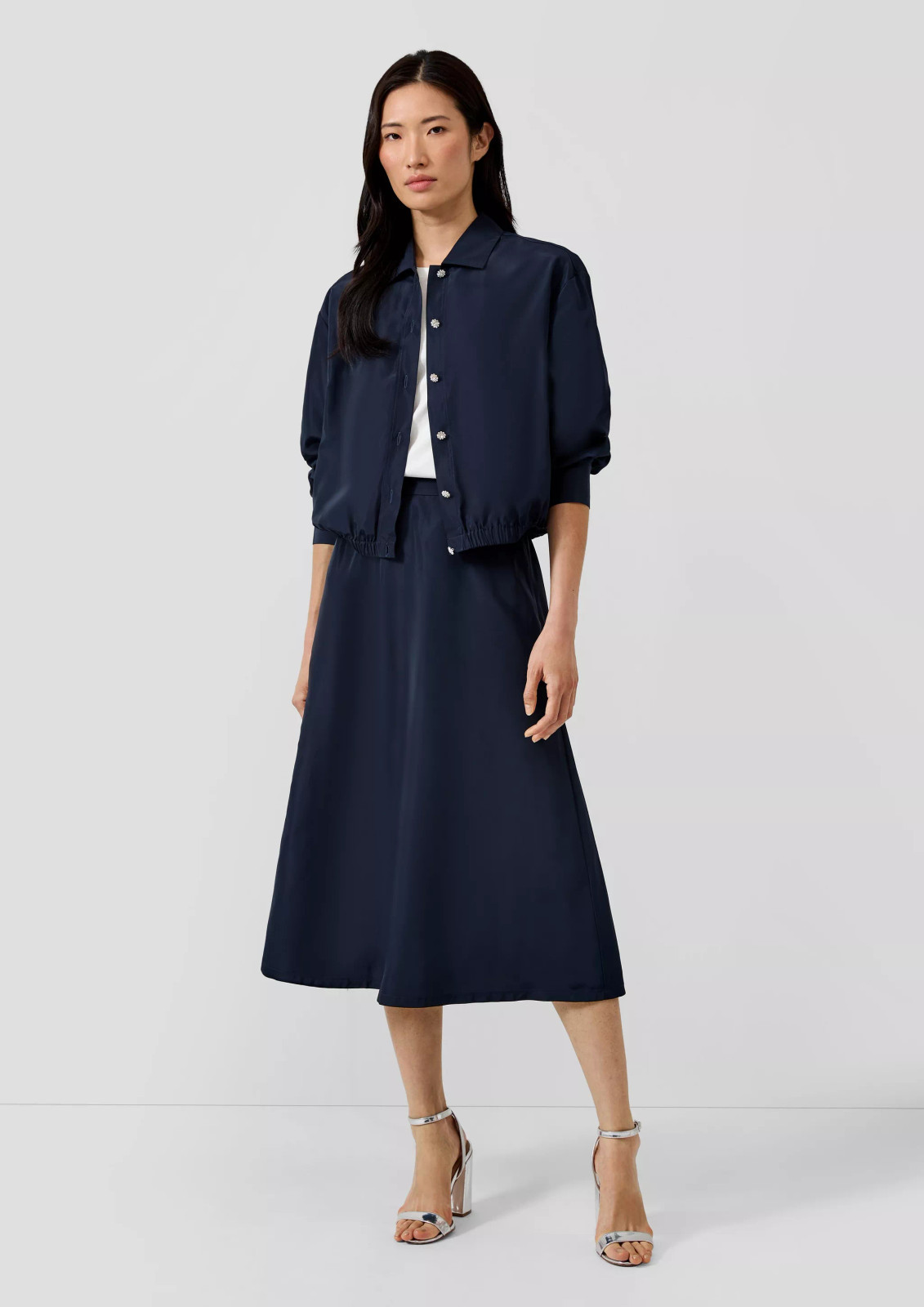A-Line Midi Skirt with Cropped Jacket and Block Heel Sandals A-Line Midi Skirt with Cropped Jacket and Block Heel Sandals — Navy Blue Midi Skirt Outfits 2027