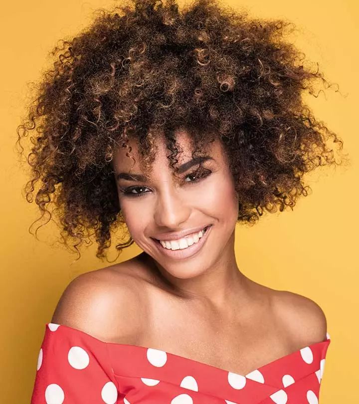 Visual Idea — A Front View Of A Woman With Short — Loose Curly Hairstyles 2027