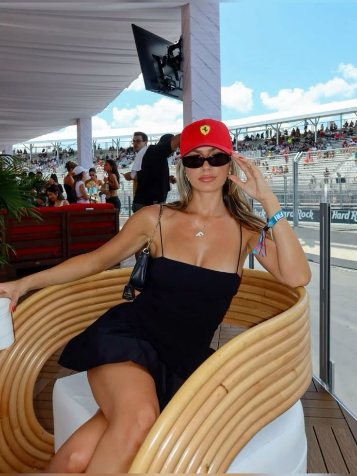 Minimalist Black Mini Dress with a Bold Red Cap Accent — F1 Race Outfits 2027