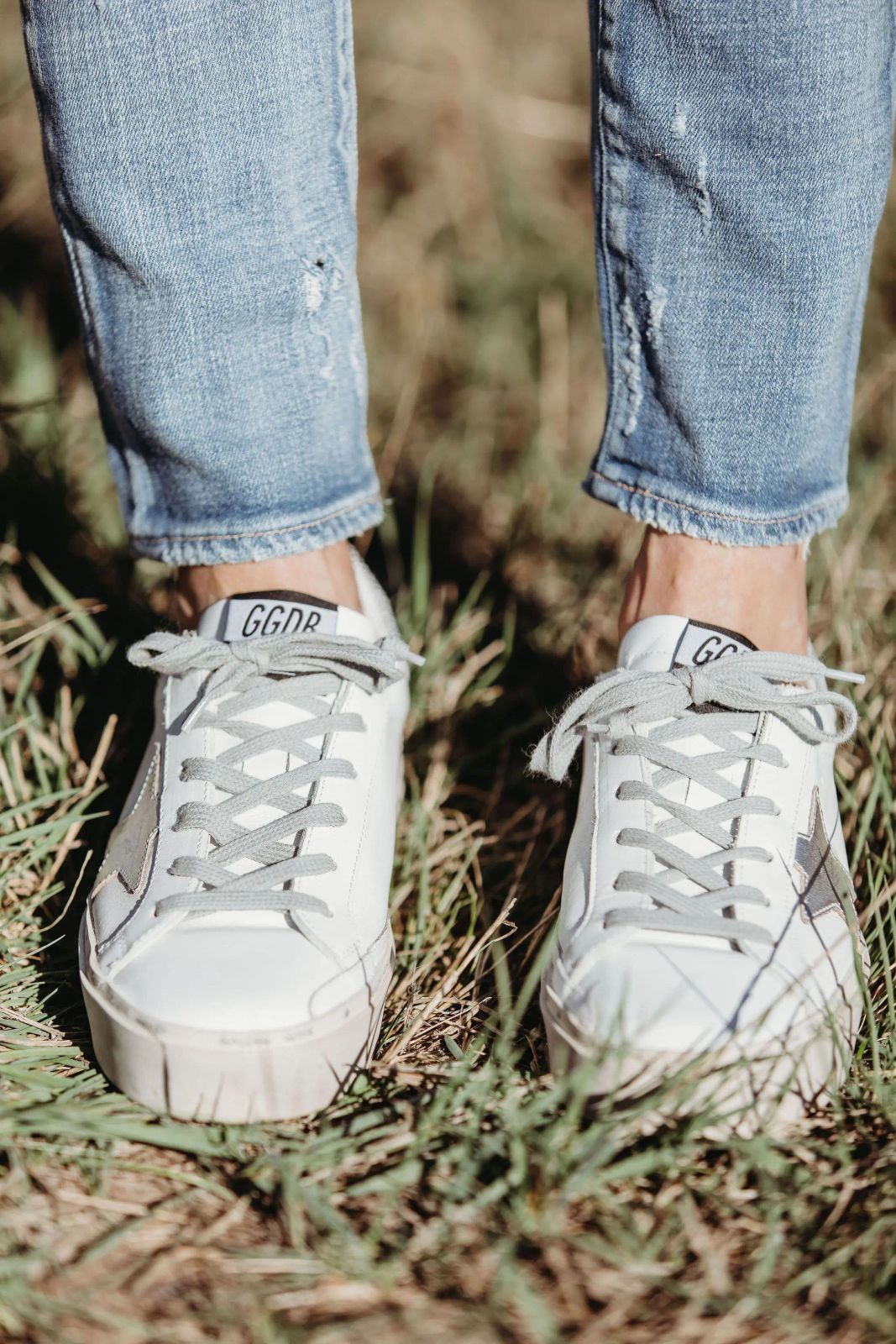 Classic White Sneakers with Ripped Jeans Detail Classic White Sneakers with Ripped Jeans Detail — Golden Goose Outfits 2027