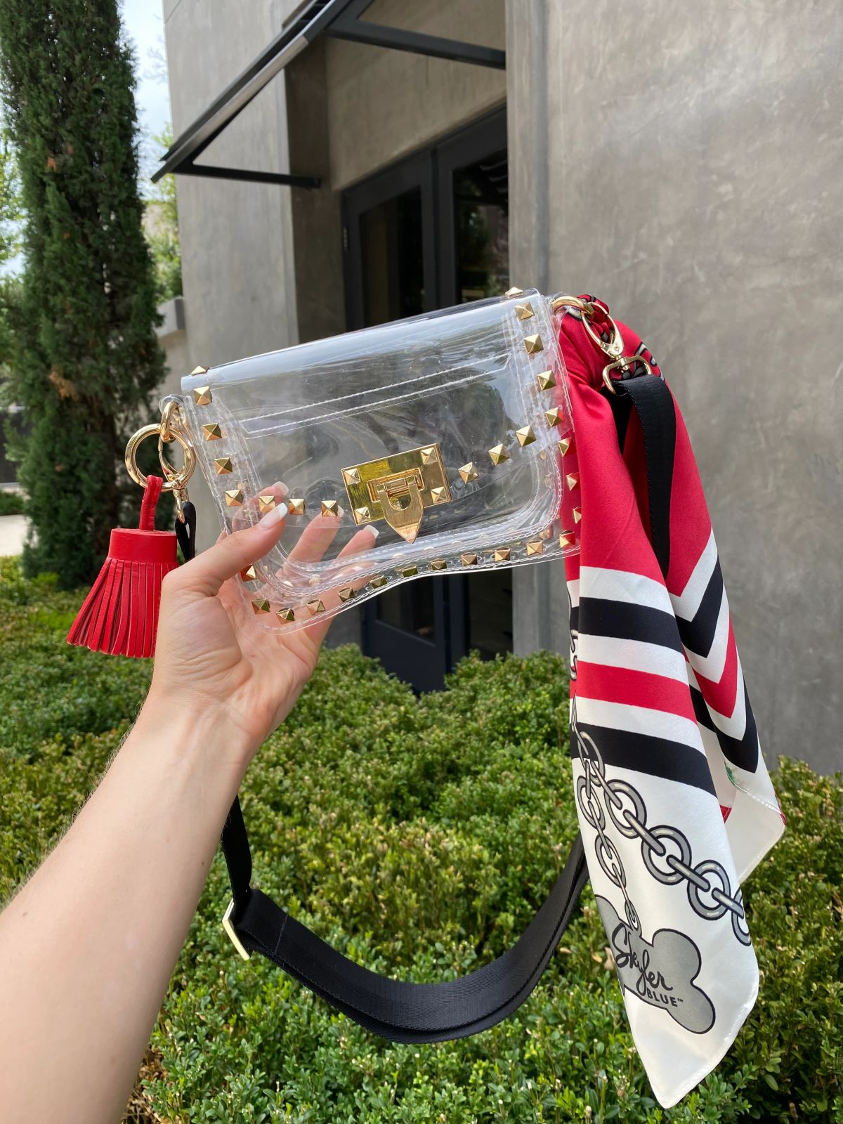 Clear Vinyl Flap Bag with Red Tassel and Scarf — Clear Bag Outfits 2027