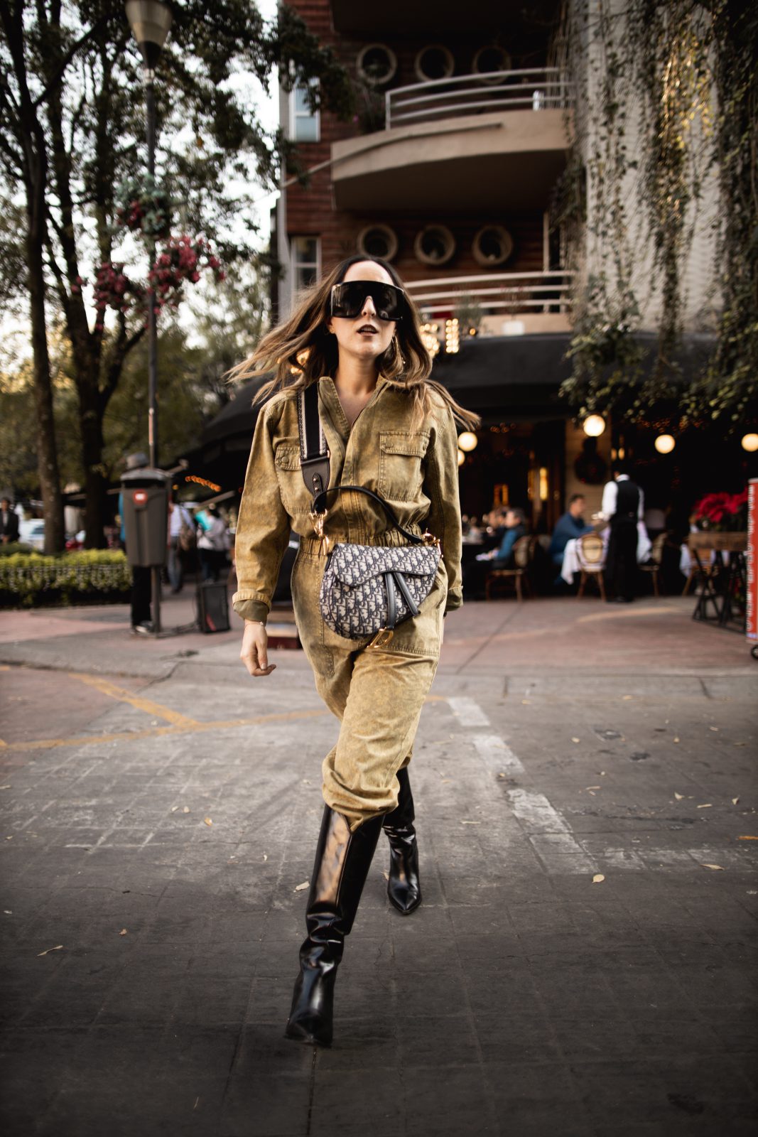 Khaki Utility Jumpsuit Styled with Black Knee-High Boots Khaki Utility Jumpsuit Styled with Black Knee-High Boots — Mexico City Outfits 2027