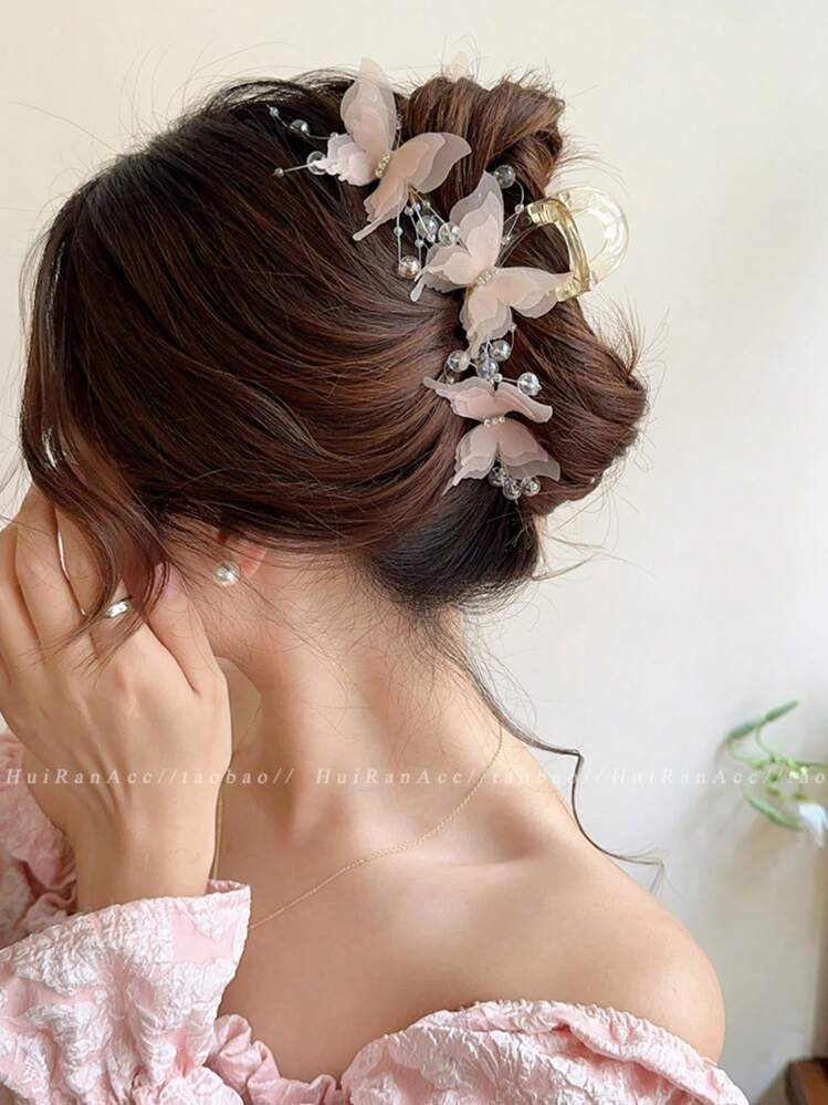 Messy Dark Bun With Sheer Butterfly Embellishments Messy Dark Bun With Sheer Butterfly Embellishments — Butterfly Hair Clip Hairstyles 2027