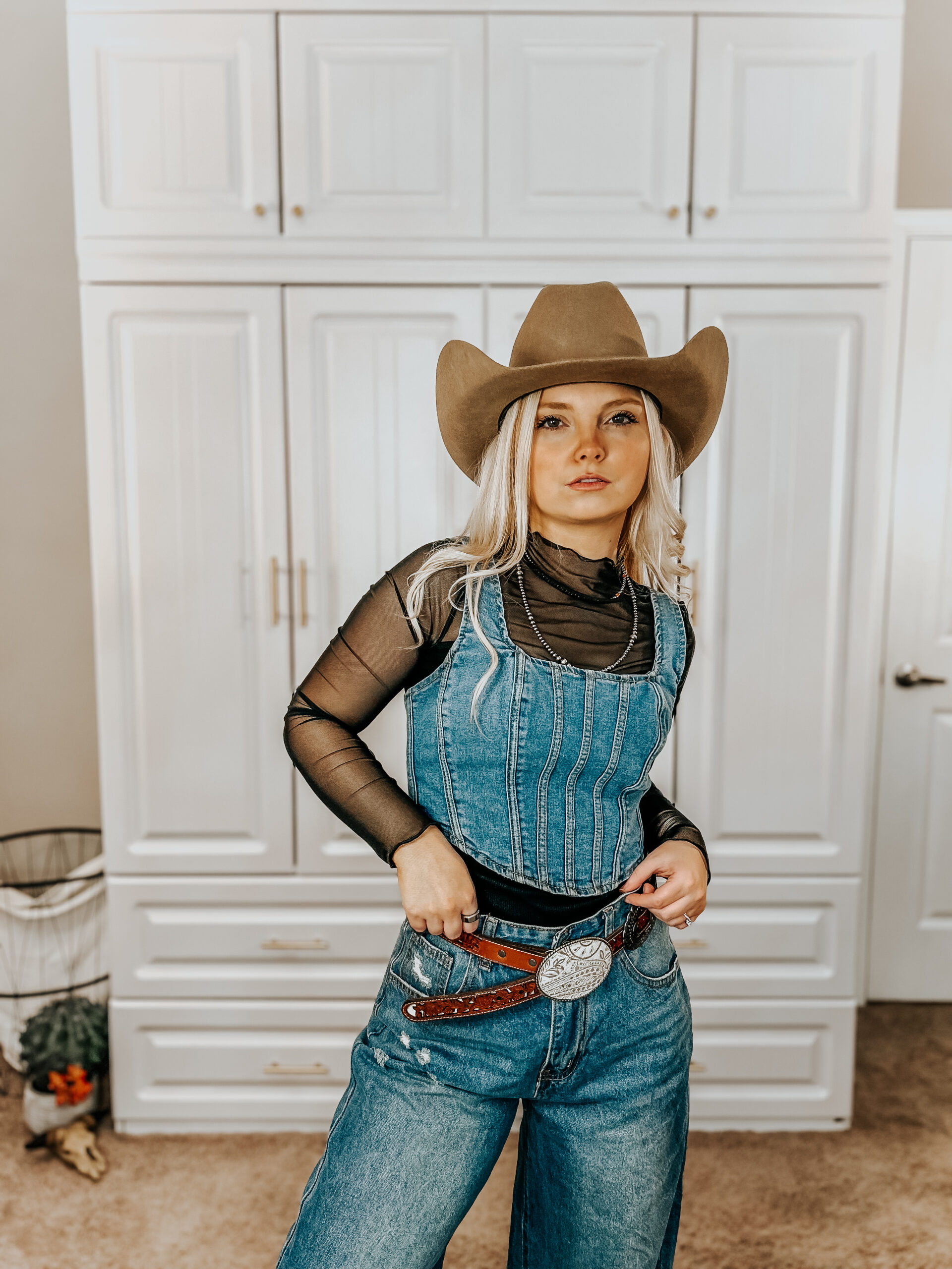Denim Vest, Mesh Top, and Wide-Leg Jeans with a Silver Western Belt Denim Vest, Mesh Top, and Wide-Leg Jeans with a Silver Western Belt — Western Belt Outfits 2027