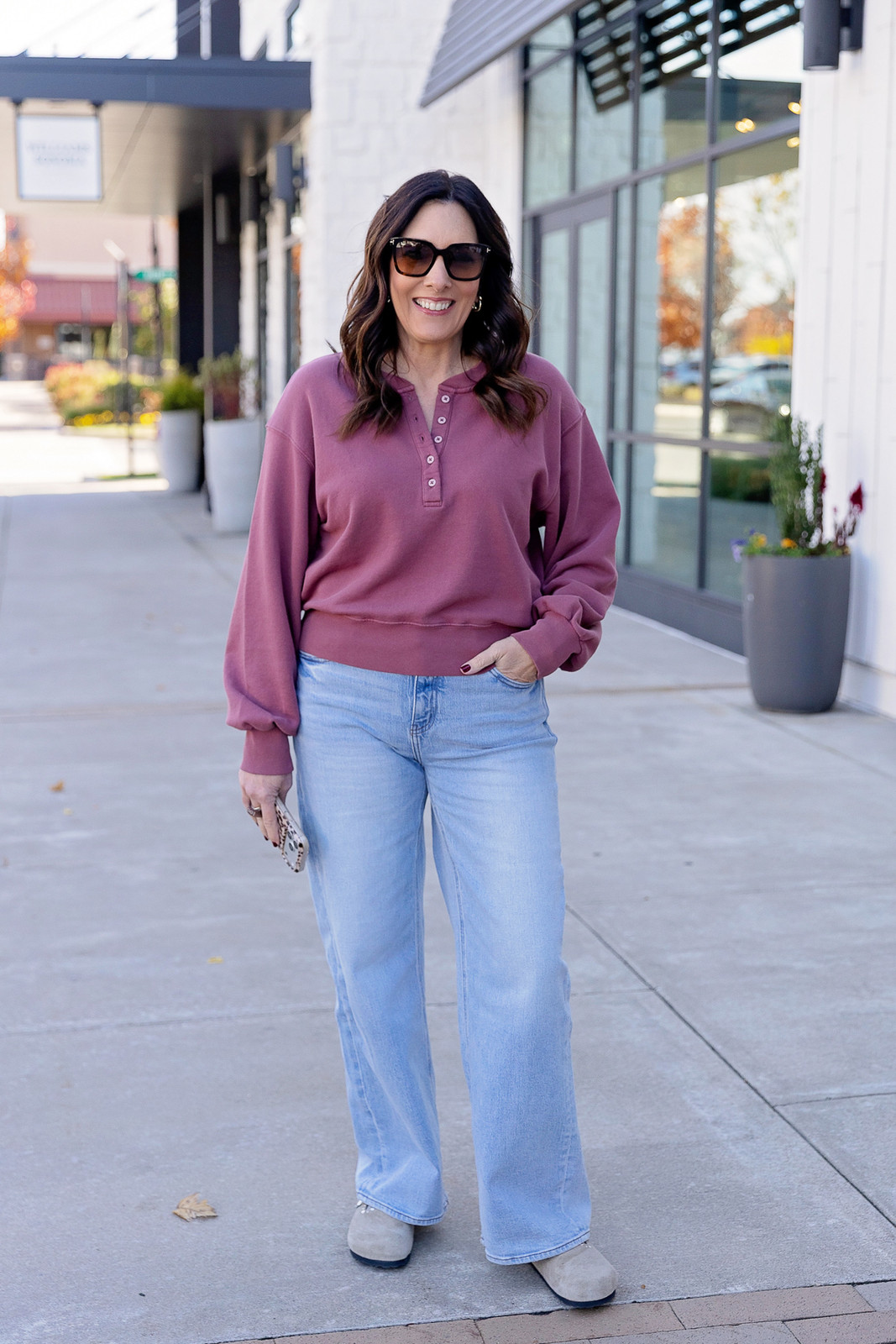 Mauve Henley Sweatshirt with Grey Clogs and Light Wash Wide-Leg Jeans Mauve Henley Sweatshirt with Grey Clogs and Light Wash Wide-Leg Jeans — Bootcut Jeans Outfits 2027 with Birkenstocks