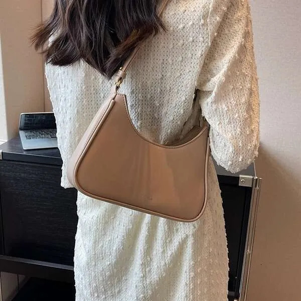 Beige Baguette Bag with Curved Silhouette and Textured Dress Beige Baguette Bag with Curved Silhouette and Textured Dress — Baguette Bag Aesthetic 2027