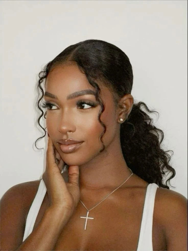 Sleek Ponytail With Face-Framing Tendrils Sleek Ponytail With Face-Framing Tendrils — Graduation Hairstyles Curls 2027
