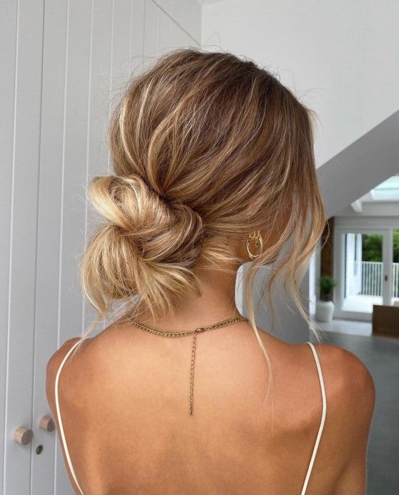 Fine Blonde Low Bun With Loose Strands Fine Blonde Low Bun With Loose Strands — Messy Low Bun 2027