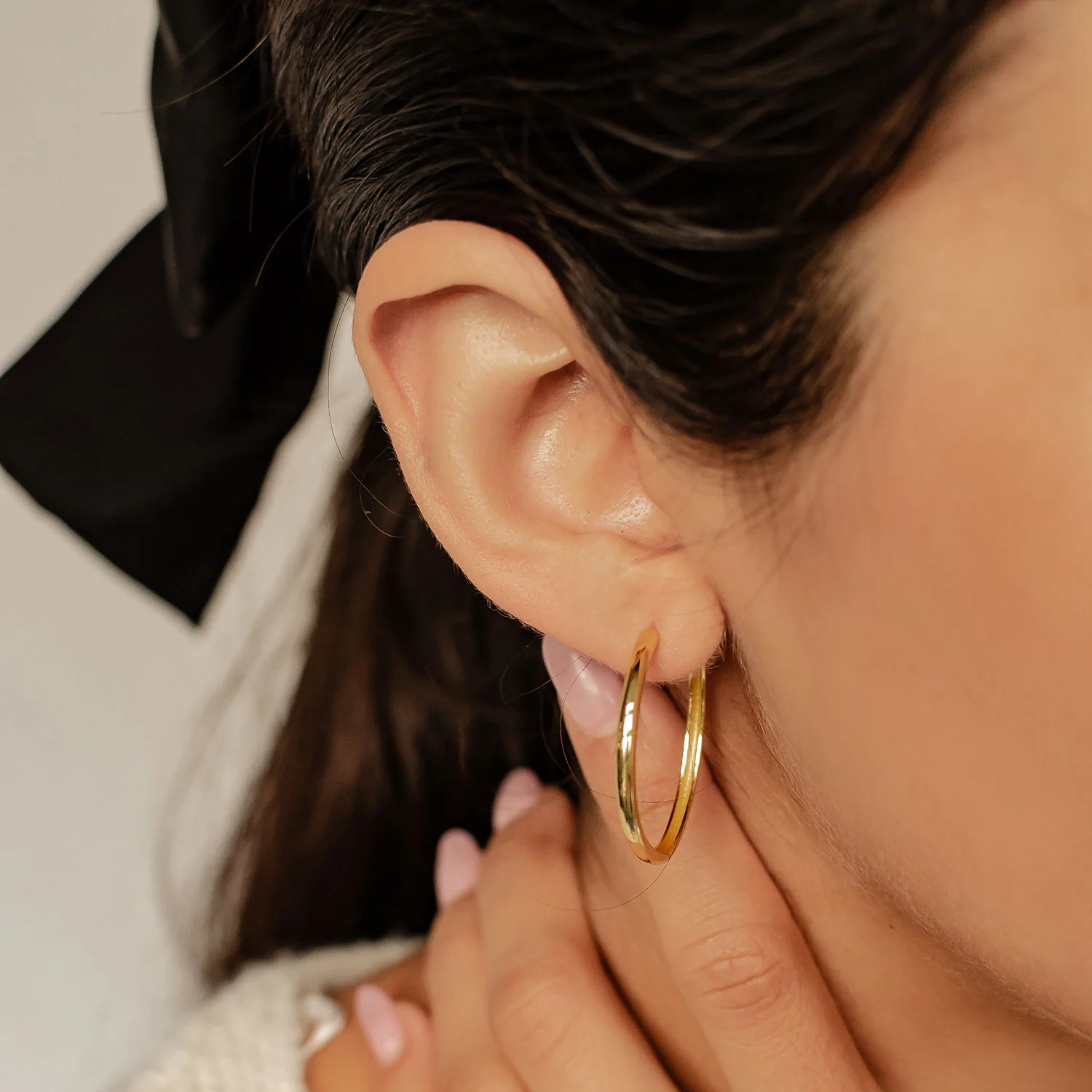Gold Hoops Complementing a Cream Knit Sweater Gold Hoops Complementing a Cream Knit Sweater — Hoop Earrings 2027