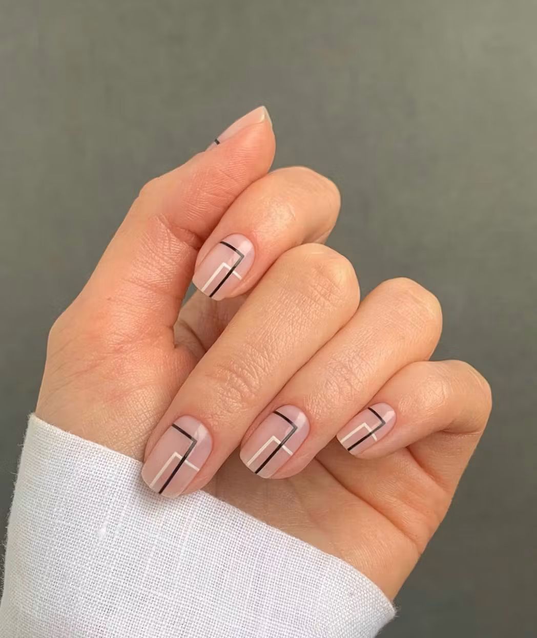 Sheer Nude Base Black And White Lines Visual Idea Sheer Nude Base Black And White Lines Visual Idea — Minimal Line Art Nails 2027