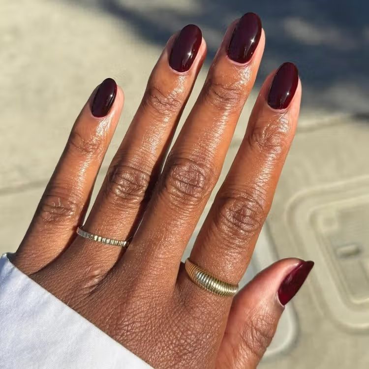 Deep Glossy Burgundy Short Oval Nails Deep Glossy Burgundy Short Oval Nails — Winter Nail Colors 2027 for Dark Skin