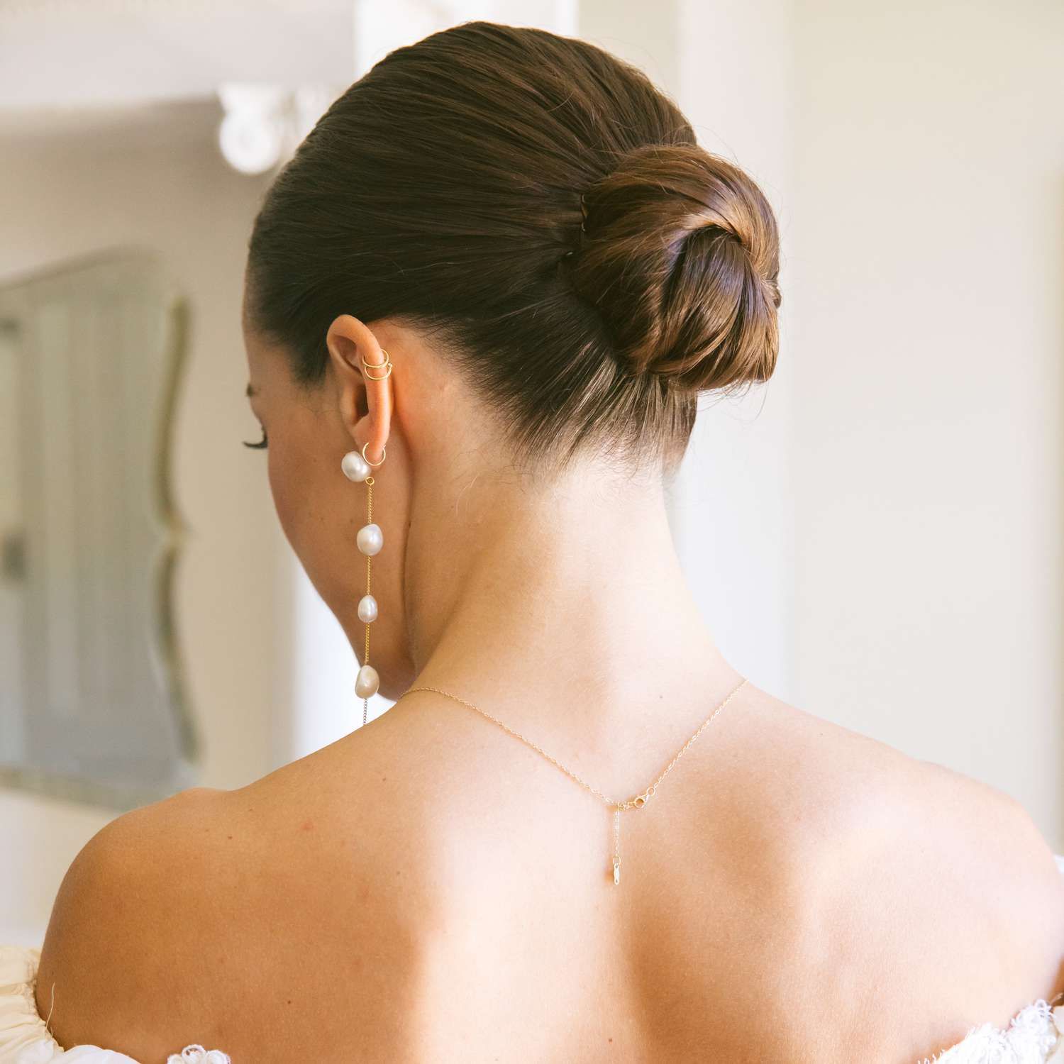 Sleek Tight Bun With Middle Part Sleek Tight Bun With Middle Part — Engagement Party Hairstyles 2027