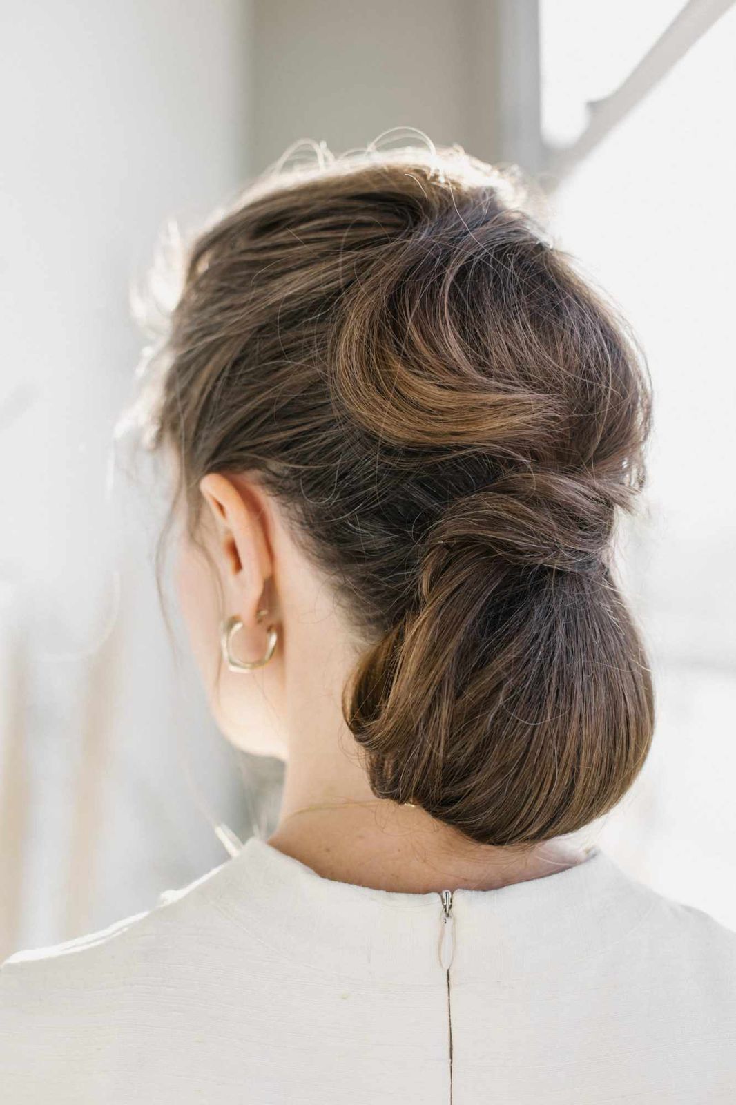 Sleek Low Bun on Long Dark Brown Hair Sleek Low Bun on Long Dark Brown Hair — Engagement Party Hairstyles 2027