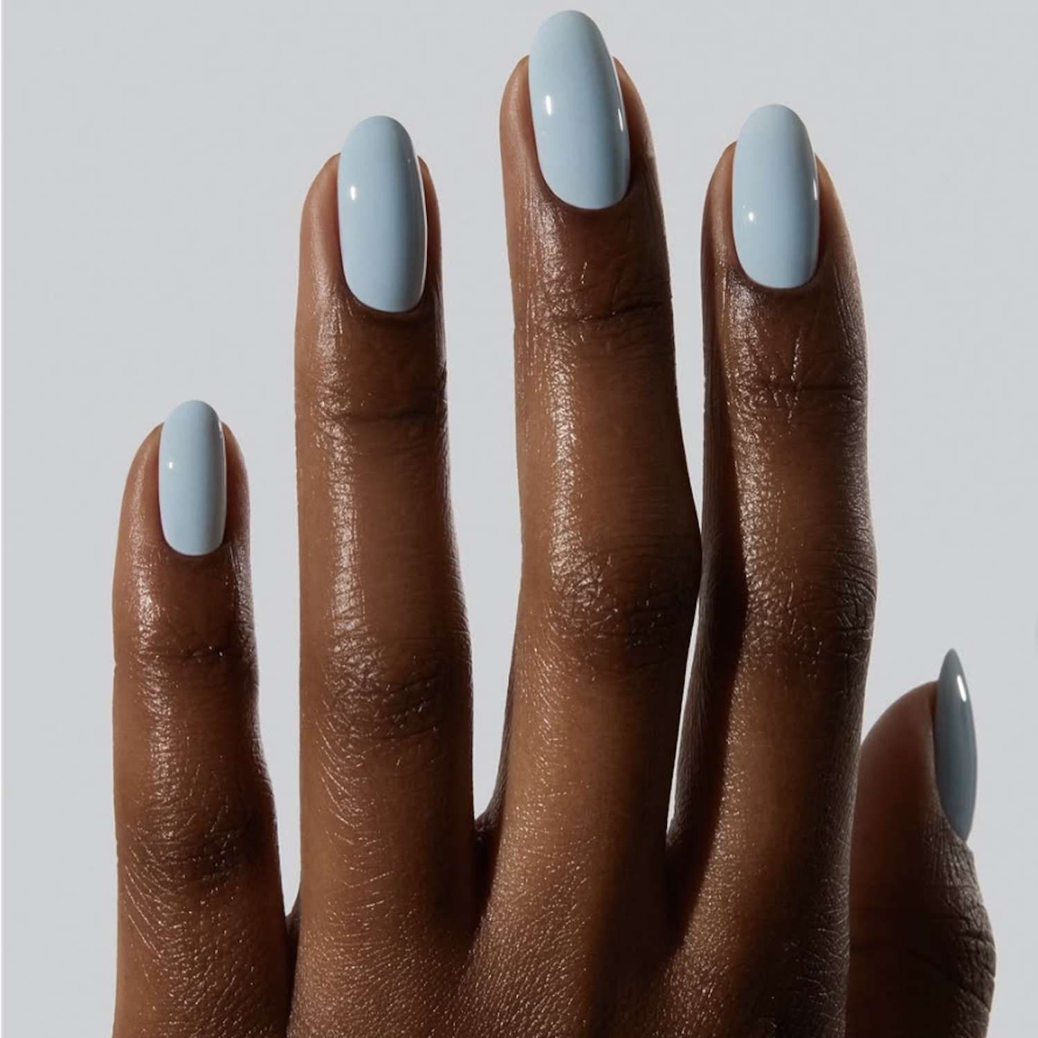 Uniform Glossy Light Sky Blue Medium Oval Nails — Pastel Nails 2027 for Brown Skin