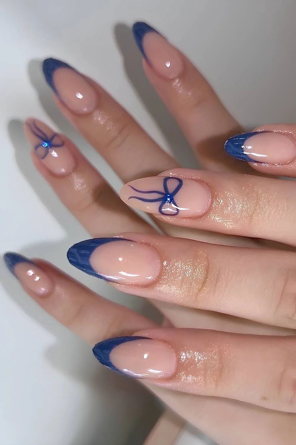 Medium Almond Dark Blue French With Rhinestone Bows Medium Almond Dark Blue French With Rhinestone Bows — Bow French Tip Nails 2027