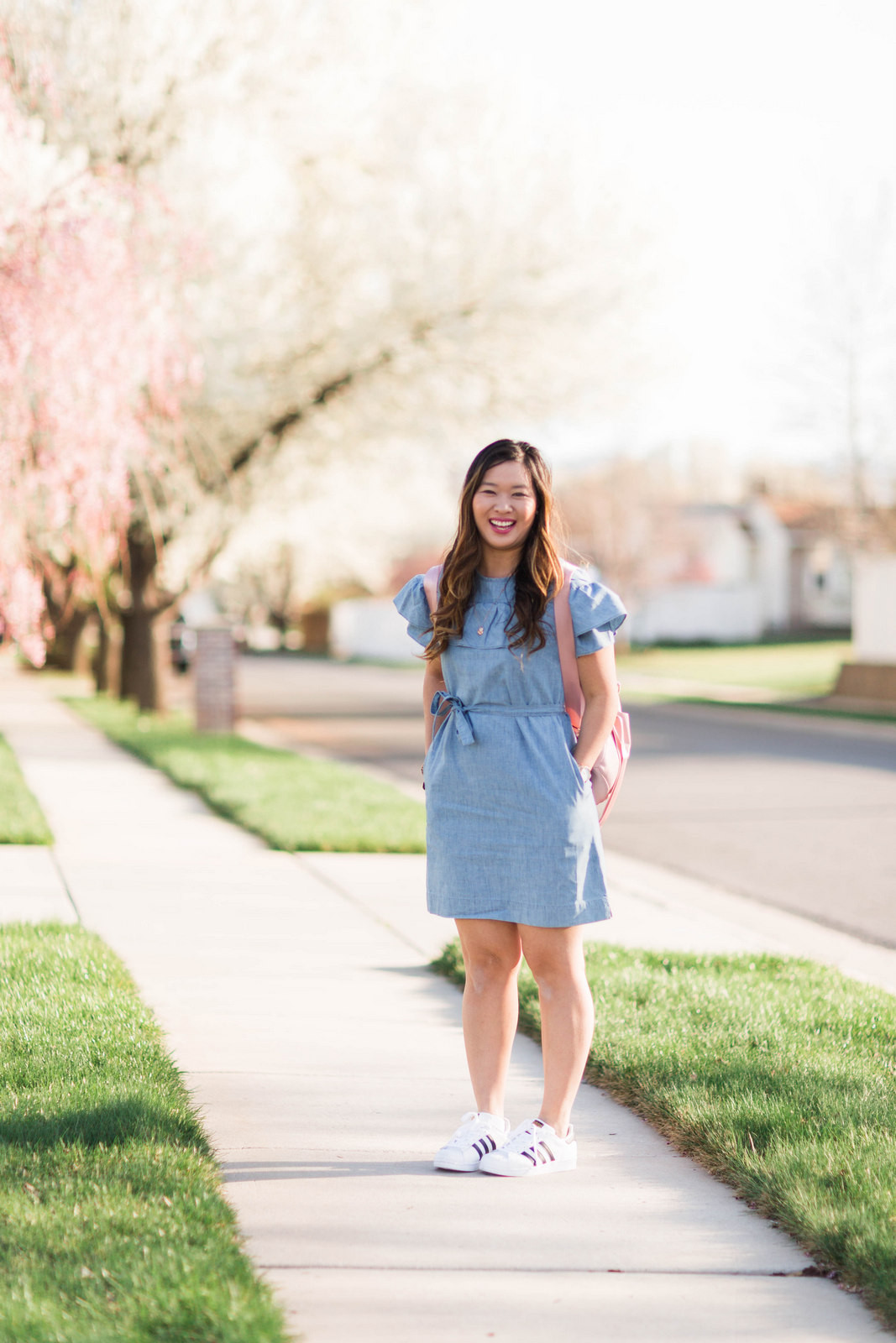 Ruffled Denim Dress with Sneakers and Backpack Ruffled Denim Dress with Sneakers and Backpack — Outfits 2027 for Mom Bod
