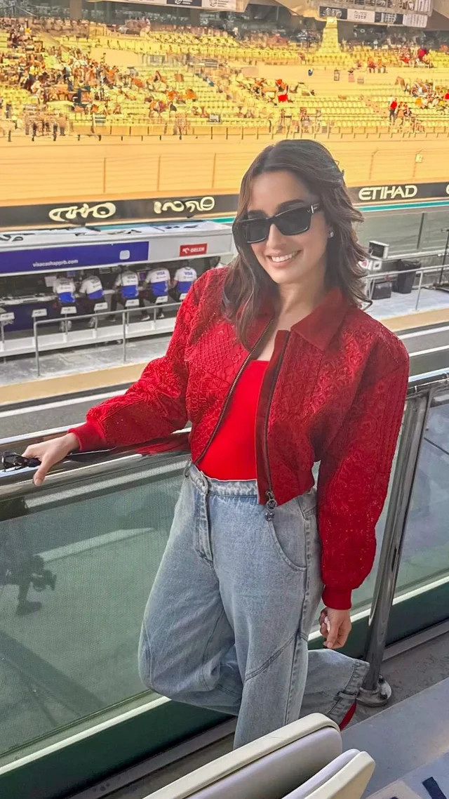 Embossed Red Bomber Jacket and Wide-Leg Jeans: Bold Casual Race Day — F1 Race Outfits 2027
