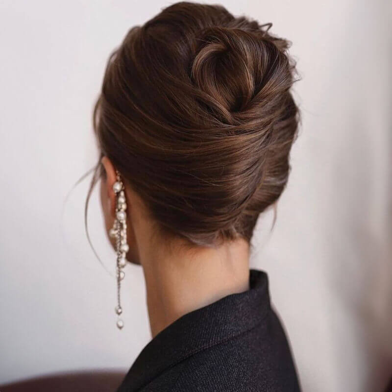 Classic Chignon Bun Classic Chignon Bun — Christmas Photo Hairstyles 2026